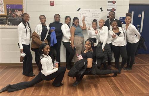 Dance Workshop Dancers dressed in black pants and white tops